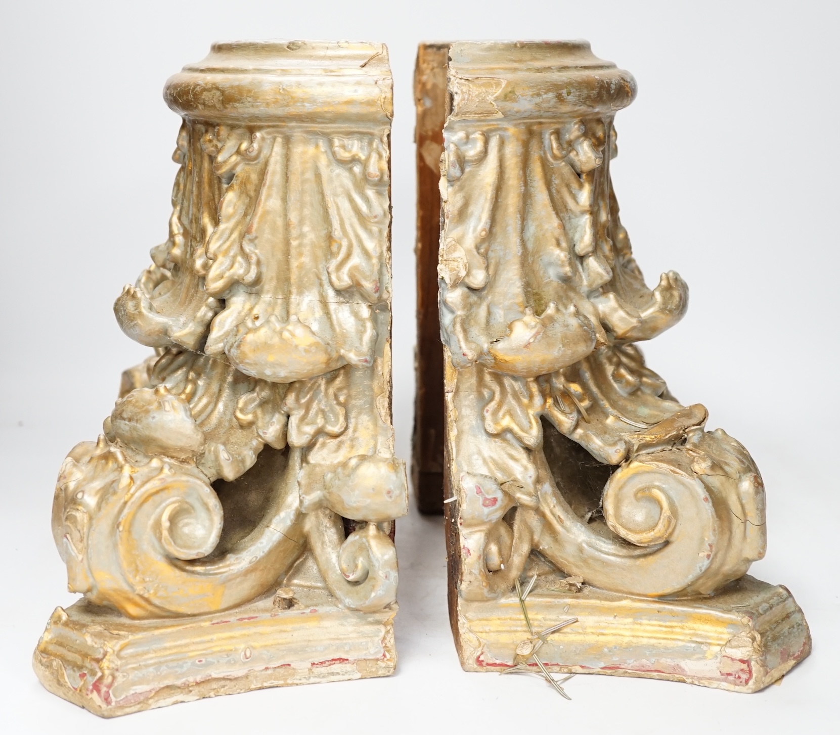 A carved wood and gesso gilt column base in two sections, 28cm high. Condition- fair